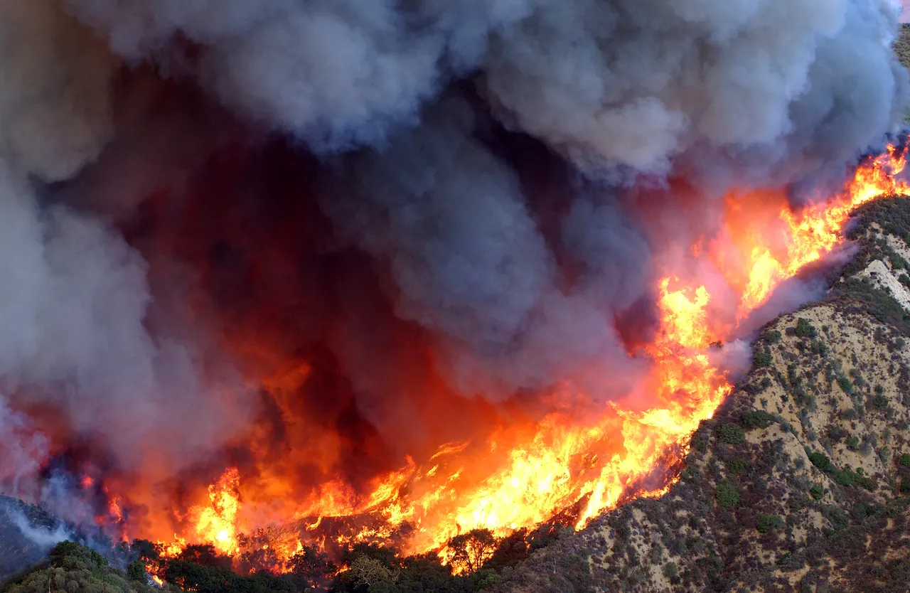 Aerial view of a wildfire burning in the hills above Simi Valley
