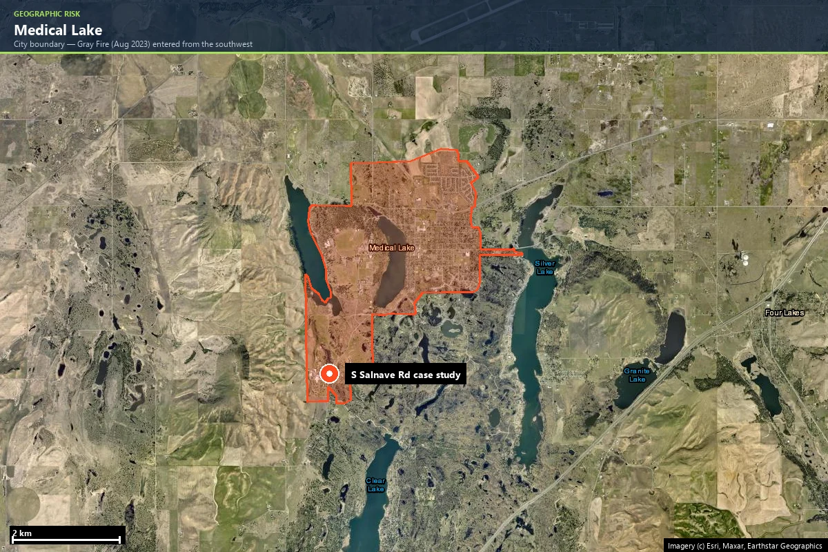 Satellite view of the Medical Lake city boundary in Spokane County, Washington, outlined in orange between Medical Lake, West Medical Lake and Silver Lake, with the South Salnave Road case-study marker in the town's southwest and visibly burned ground from the 2023 Gray Fire around the lakes